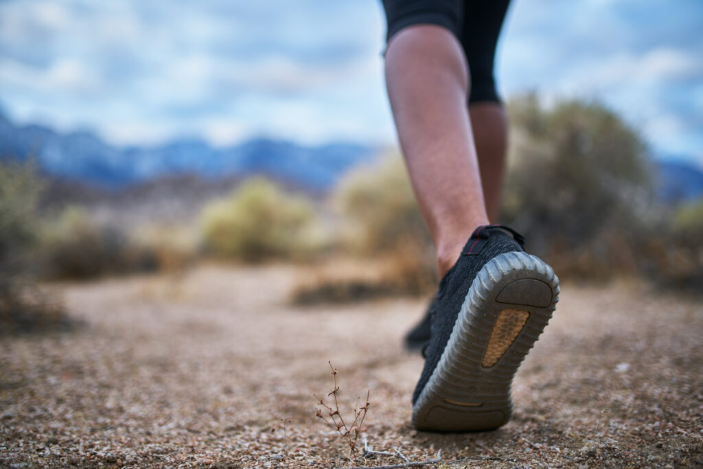 close up of hikers leg and shoe while walking thro 2026 01 06 09 29 53 utc